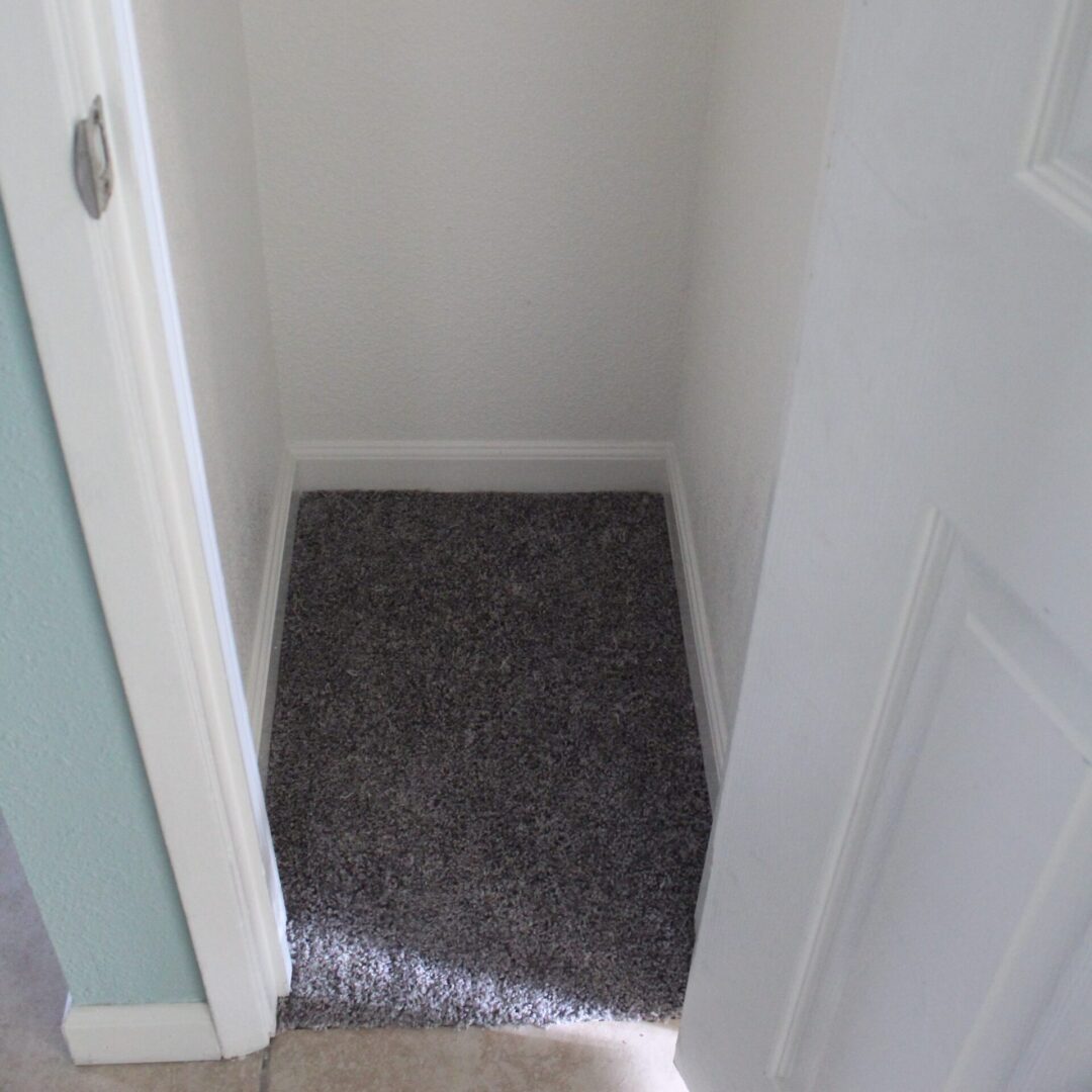 Closeup view of a small room with a mat